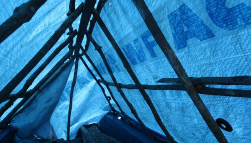 A plastic tarp can be used to cover the wooden structure of the airplane. A plastic tarp can be used to cover the wooden structure of the airplane.