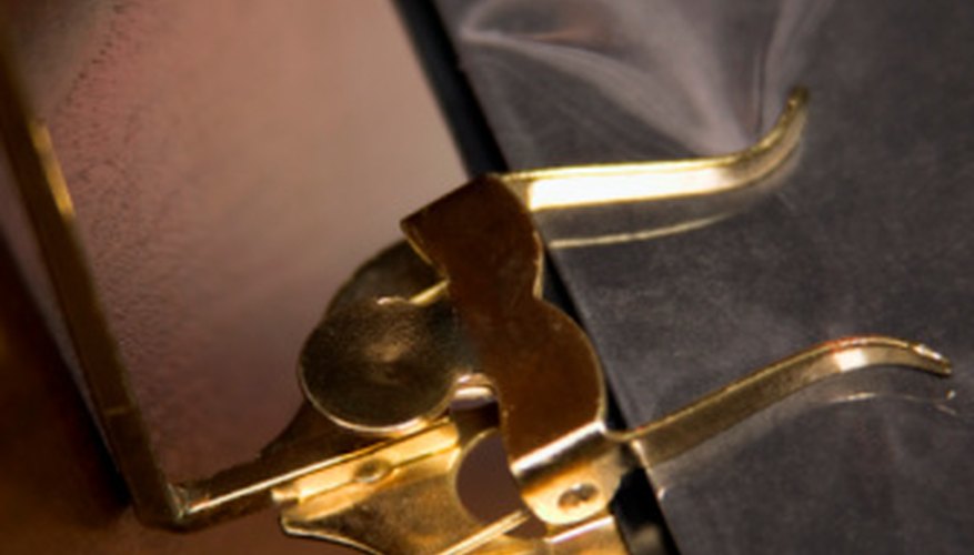Lyres are used to hold music for musicians who are required to be in motion. Lyres are used to hold music for musicians who are required to be in motion.