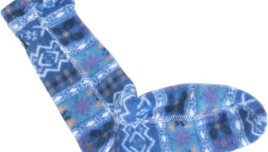 Knit a pair of socks on a round loom. Knit a pair of socks on a round loom.