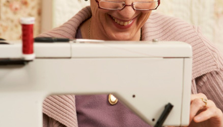 A walking foot feeds multiple layers of fabric through the machine simultaneously. A walking foot feeds multiple layers of fabric through the machine simultaneously.
