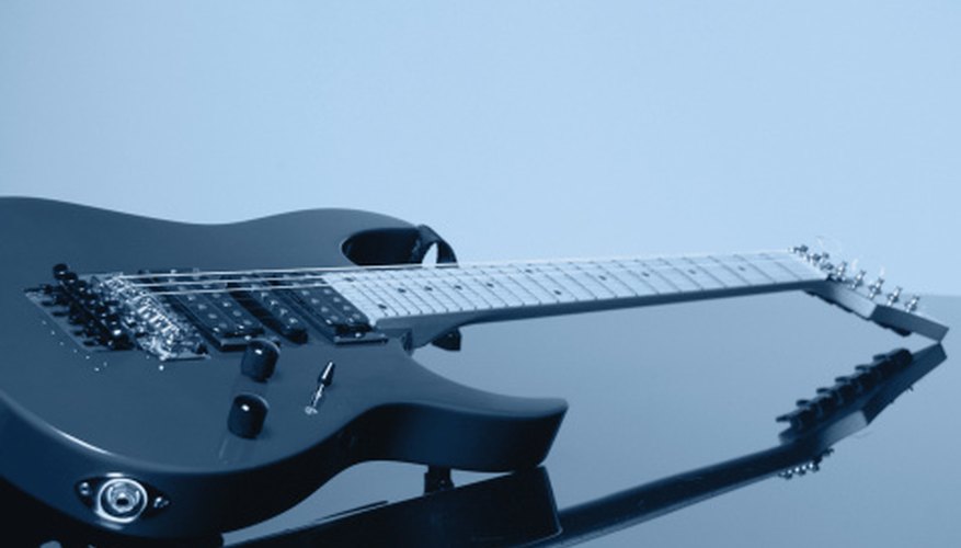 Most guitars have the output jack located either on the edge of the bottom bout, as shown here, or on the top near the controls. Most guitars have the output jack located either on the edge of the bottom bout, as shown here, or on the top near the controls.