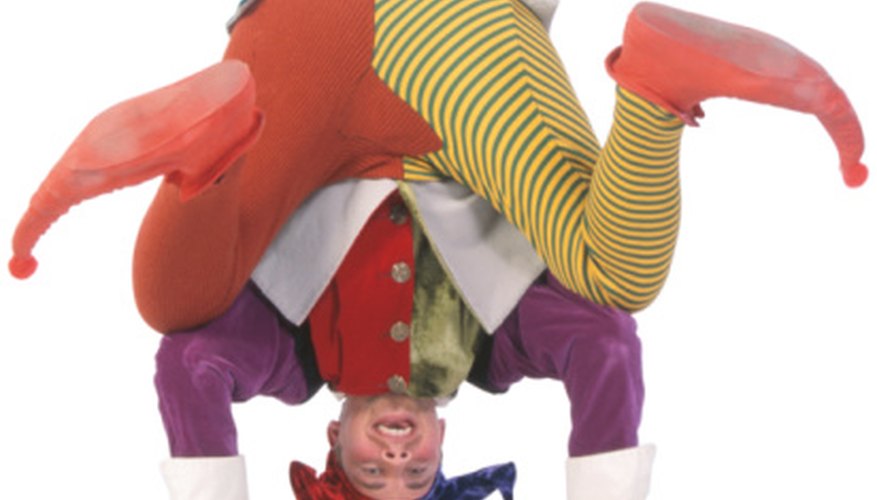 Photo Credit: Ablestock.com/AbleStock.com/Getty Images Jesters often balanced on their head while tellling jokes.