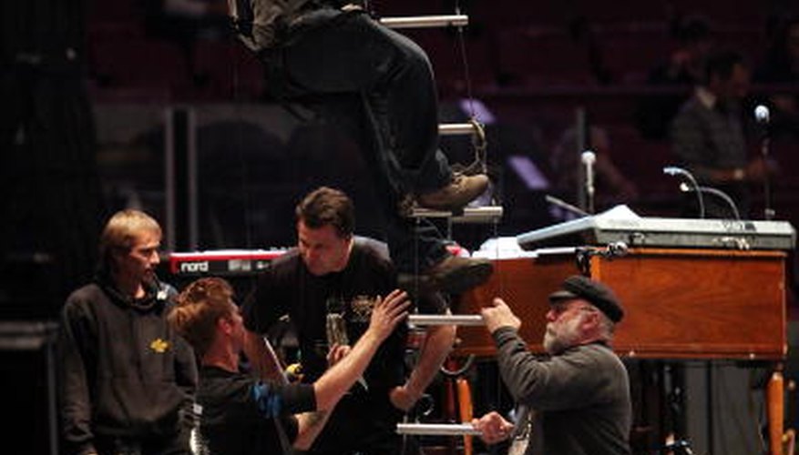 Photo Credit: Roger Kisby/Getty Images Entertainment/Getty Images Bruce Springsteen's crew rig up the lights.
