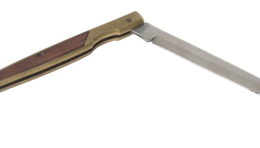 All switchblades have a lever or button to lock the blade in place. All switchblades have a lever or button to lock the blade in place.