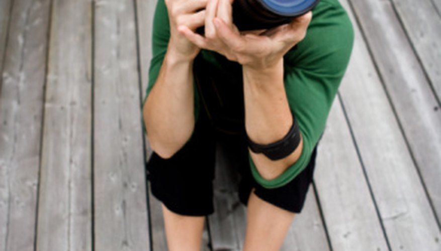 Angle your lens to help take photos without glare. Angle your lens to help take photos without glare.