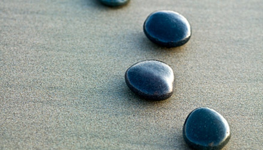Zen gardens are made of sand and polished stones. Zen gardens are made of sand and polished stones.