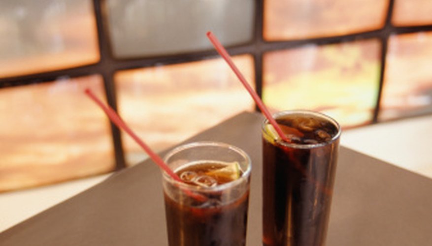 Cola, a plant native to Ghana, is used to flavor soft drinks. Cola, a plant native to Ghana, is used to flavor soft drinks.