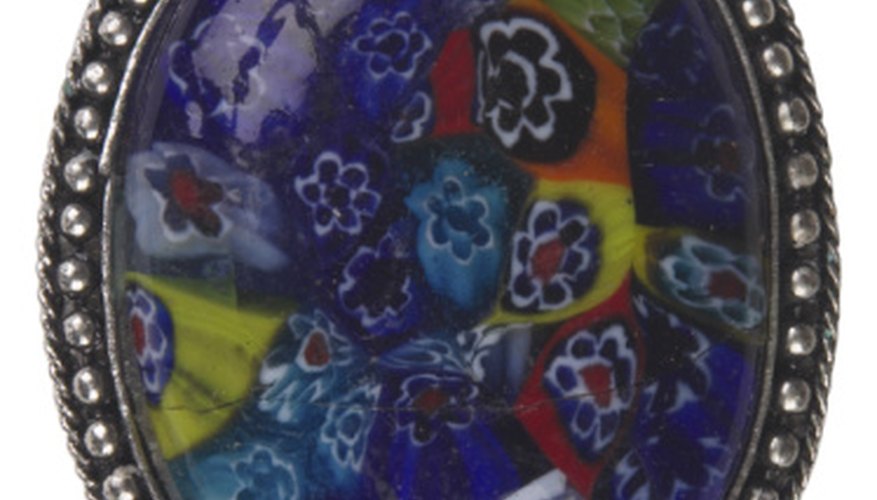 Enamel adds color to silver from melting glass on top of the metal. Enamel adds color to silver from melting glass on top of the metal.