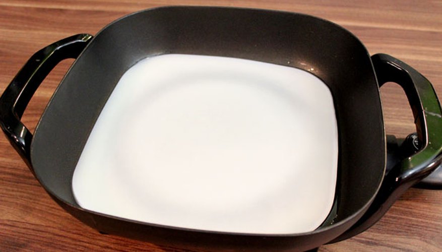 Melt beeswax in an electric skillet Melt beeswax in an electric skillet