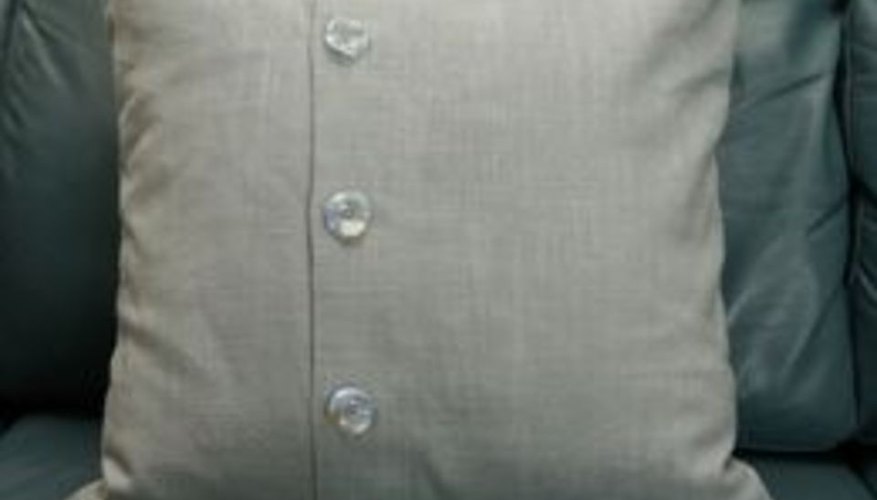 Envelope-back pillow with decorative buttons. Envelope-back pillow with decorative buttons.