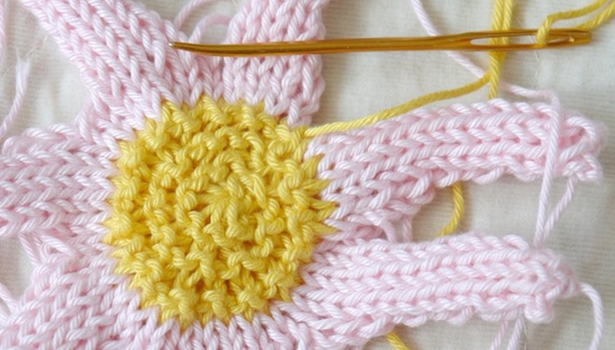 Pull the stitches to close any gaps in the flower. Pull the stitches to close any gaps in the flower.