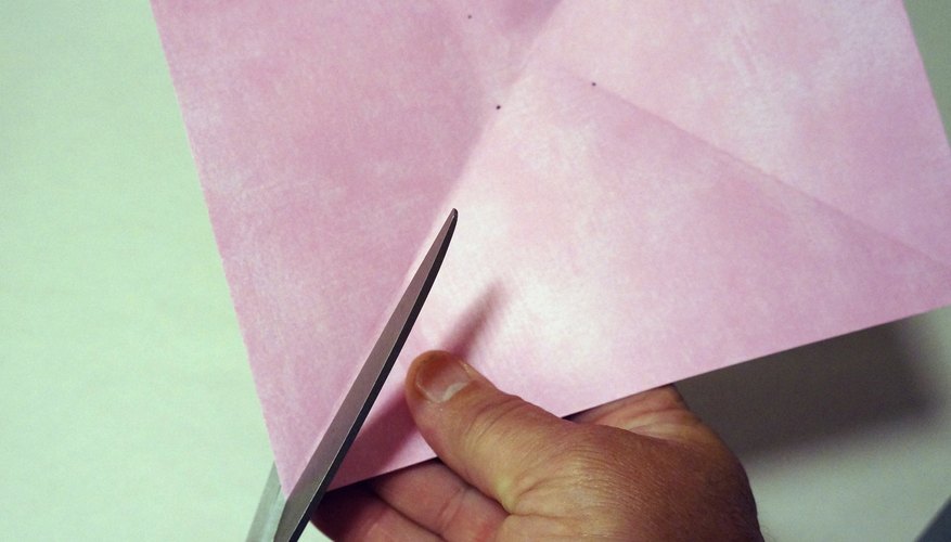Cut each crease to the stop mark. Cut each crease to the stop mark.