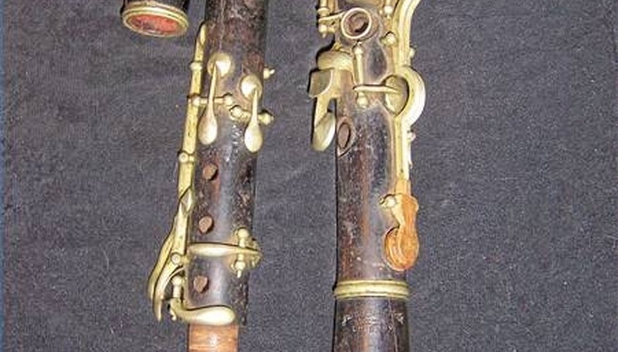 Very old clarinet in D. Note the red string around the tenon joint and the wooden key. Very old clarinet in D. Note the red string around the tenon joint and the wooden key.