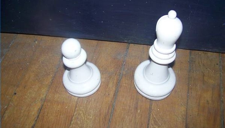 Lawn chess pieces crafted from wood and painted Lawn chess pieces crafted from wood and painted