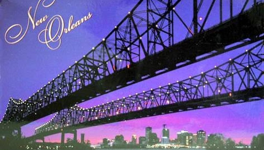 A postcard depicting the bridge connecting the east and west banks of New Orleans. A postcard depicting the bridge connecting the east and west banks of New Orleans.