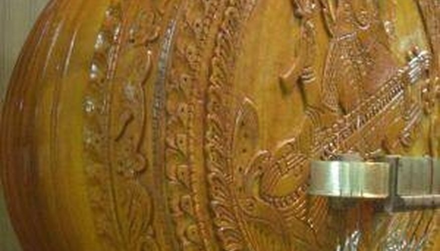 A veena kudam is sometimes made from ornately carved wood. A veena kudam is sometimes made from ornately carved wood.