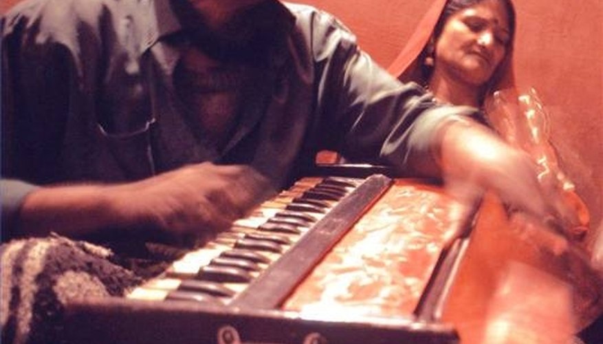 Man playing a harmonium in Bikaner, Rajasthan, India Man playing a harmonium in Bikaner, Rajasthan, India