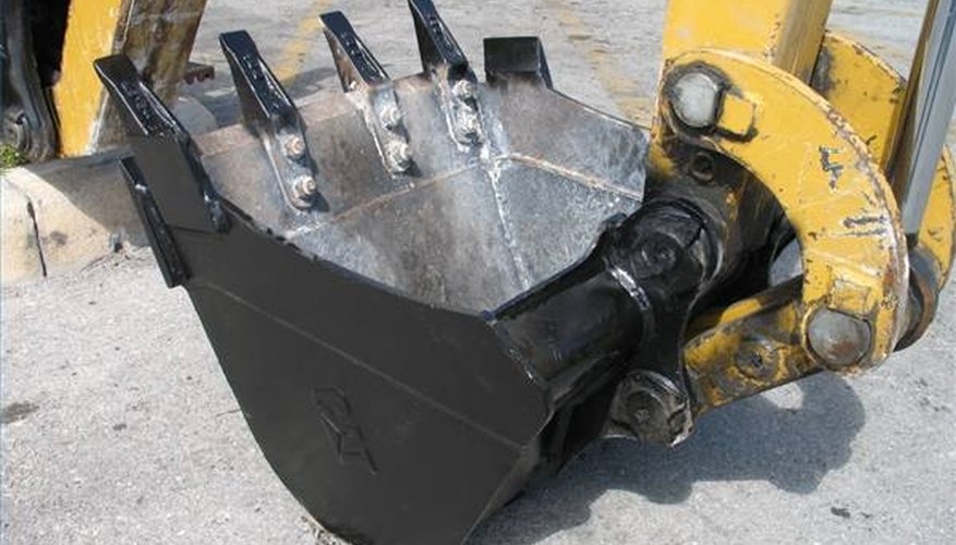 Use bucket on excavator to break the larger pieces of asphalt into smaller ones. Use bucket on excavator to break the larger pieces of asphalt into smaller ones.
