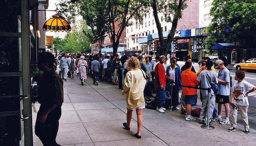 Customers Queuing Outside a Movie Theater Customers Queuing Outside a Movie Theater