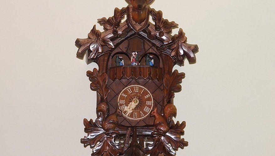 Cuckoo clock with traditional stag's head decoration. Cuckoo clock with traditional stag's head decoration.