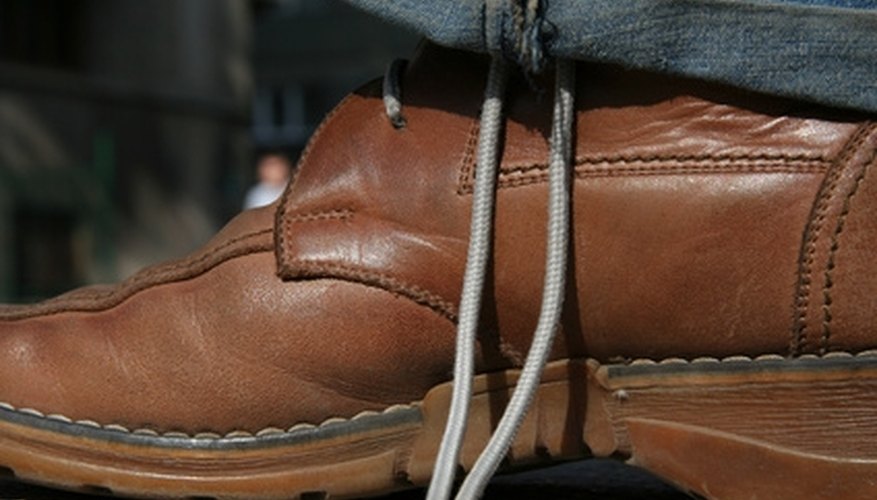 Hold the bottom of the bow steady, using your foot. Hold the bottom of the bow steady, using your foot.