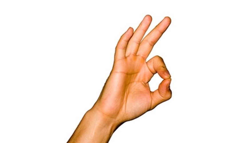 Keep your other three fingers raised, so you do not trap them under the string. Keep your other three fingers raised, so you do not trap them under the string.