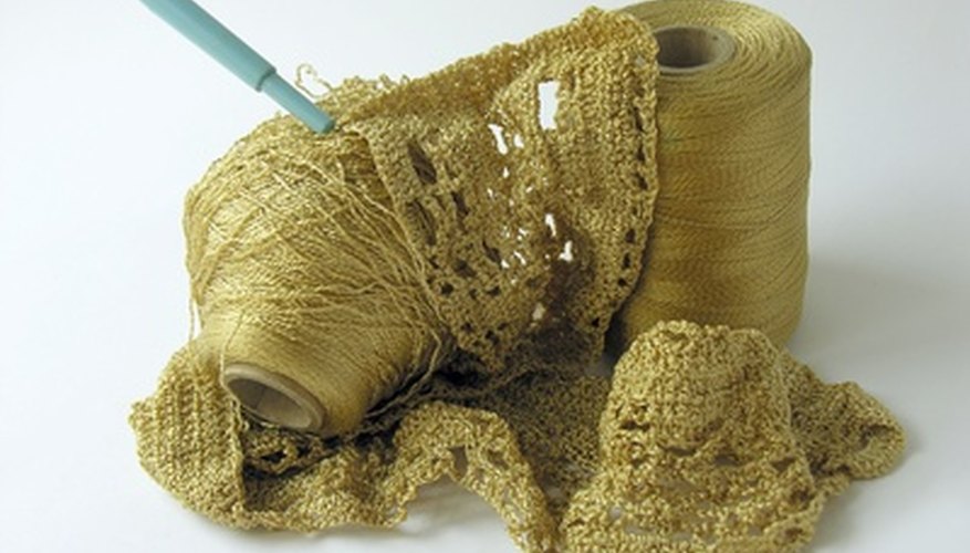 Edge the cross with gold crochet thread for a regal look. Edge the cross with gold crochet thread for a regal look.