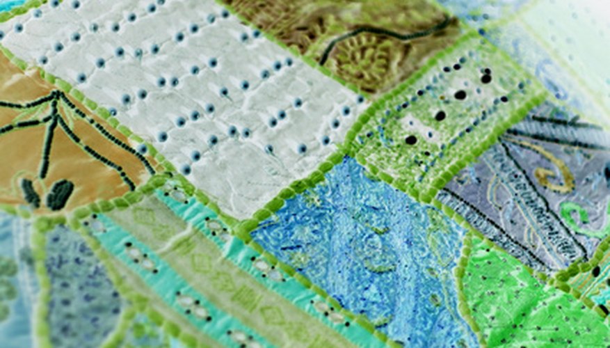 A patchwork quilt is one type of quilt made of fabric pieces. A patchwork quilt is one type of quilt made of fabric pieces.