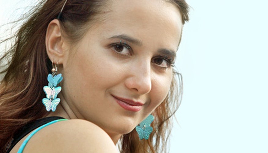 Many women own earrings to match every outfit. Many women own earrings to match every outfit.