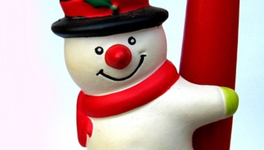 Make a snowman's top hat out of newspaper and black spray paint. Make a snowman's top hat out of newspaper and black spray paint.