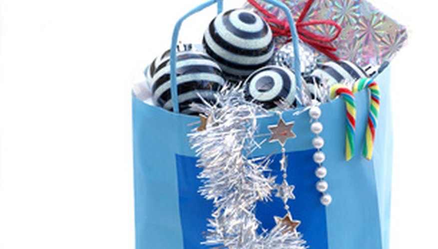 Make your own gift bags out of recycled paper. Make your own gift bags out of recycled paper.