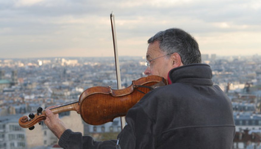 Fix a loose string on your violin, and tune it to keep it sounding its best. Fix a loose string on your violin, and tune it to keep it sounding its best.
