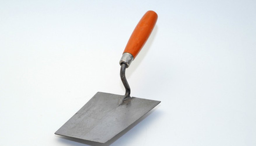 Use the flat edge of the trowel to smooth out any repaired areas. Use the flat edge of the trowel to smooth out any repaired areas.