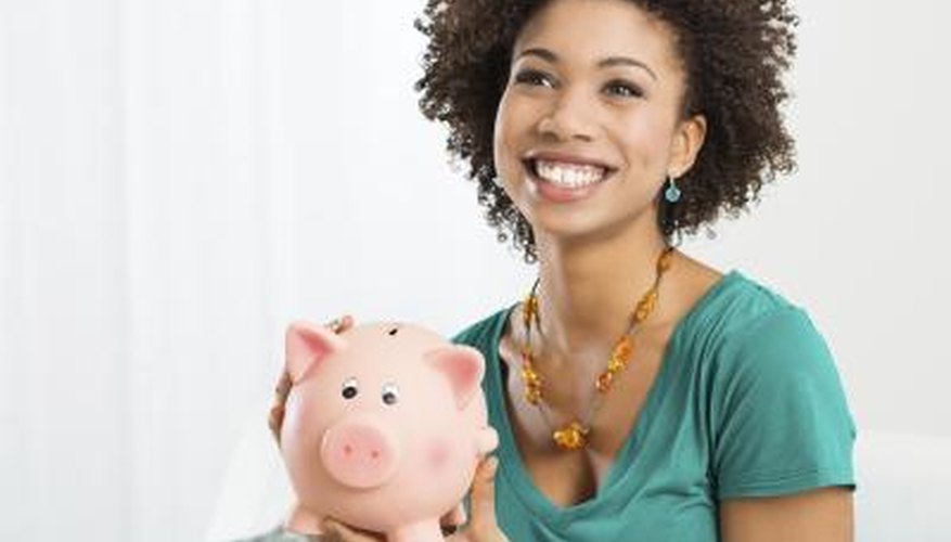 teenage girl with piggy bank teenage girl with piggy bank