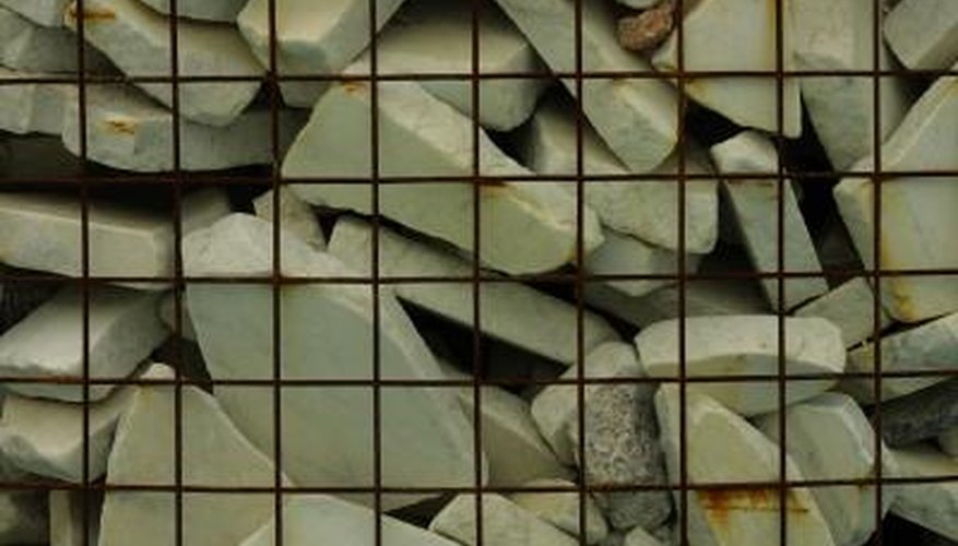 Gabions combine small rocks and mesh. Gabions combine small rocks and mesh.