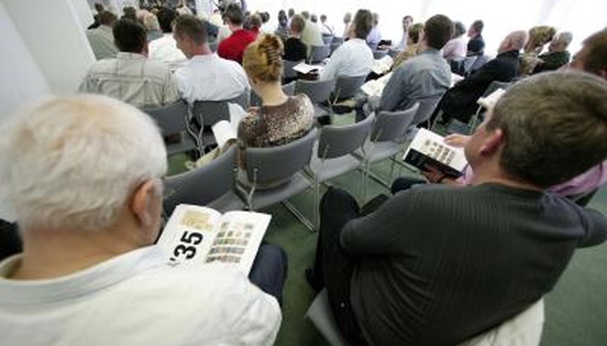 Collectors at stamp auction Collectors at stamp auction