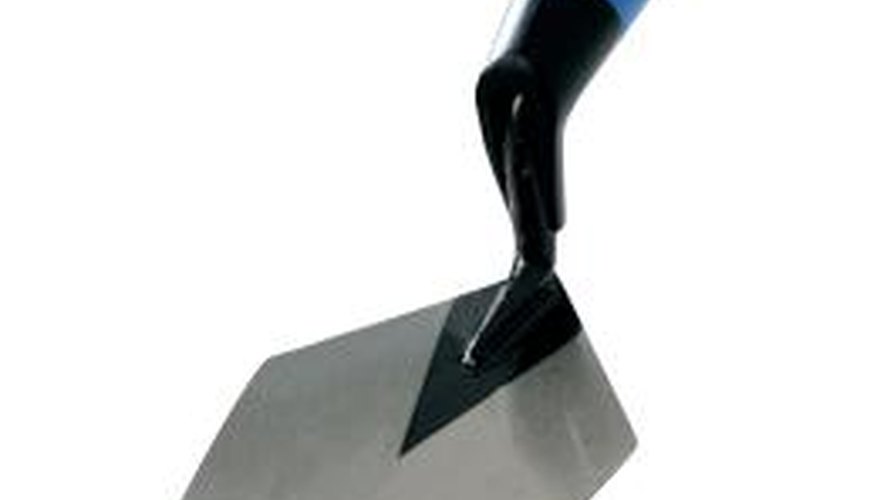 Use the trowel to lay and strike mortar, and butter the bricks. Use the trowel to lay and strike mortar, and butter the bricks.