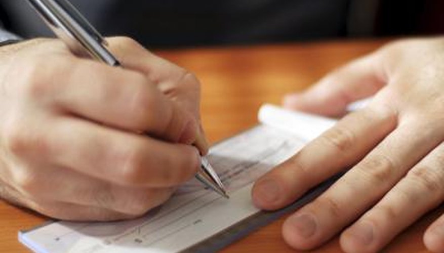 Man writing check Man writing check