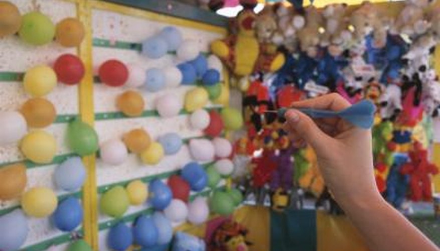 Throw darts and pop the balloons to win Throw darts and pop the balloons to win