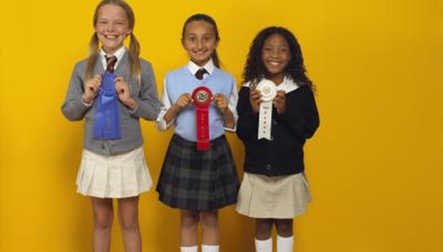 3 young girls with Science Fair ribbons. 3 young girls with Science Fair ribbons.