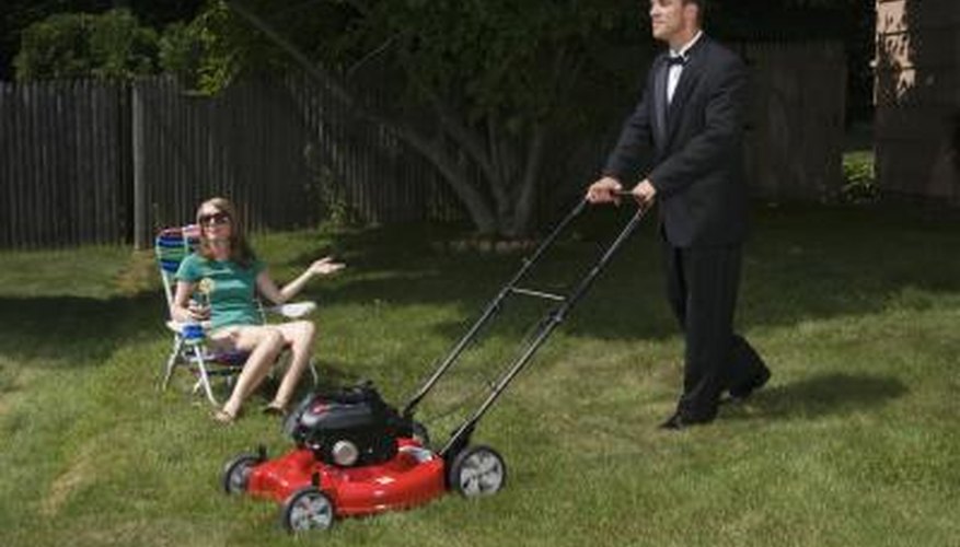 Man in suit mowing lawn slowly. Man in suit mowing lawn slowly.