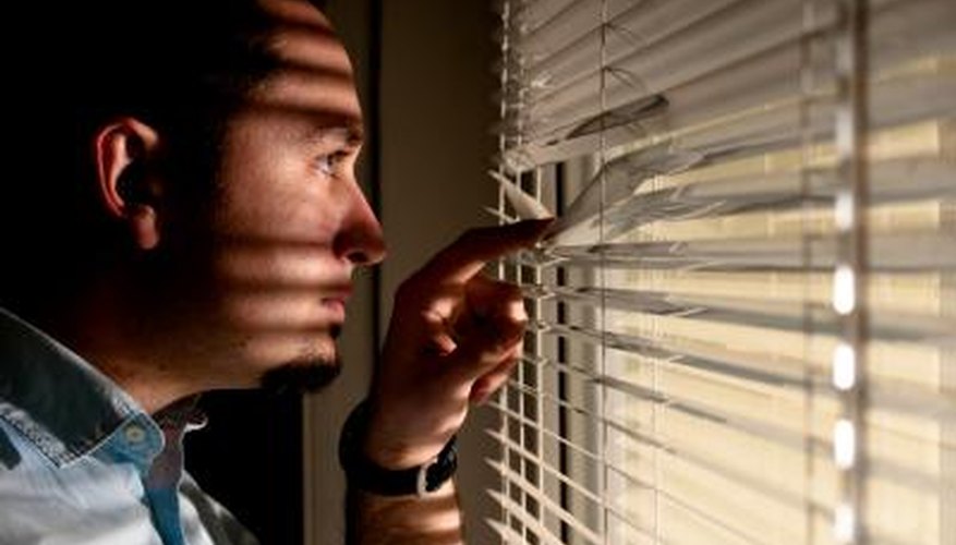 Man spying out window Man spying out window