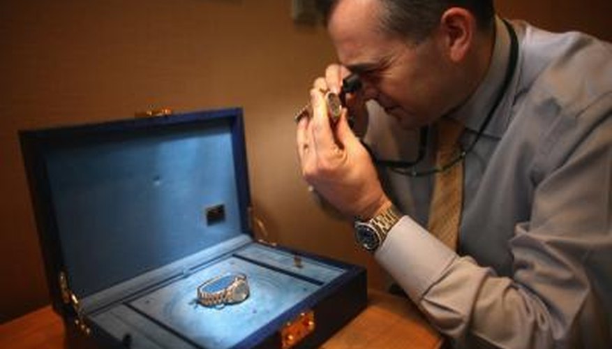 Watch expert examines wrist watch Watch expert examines wrist watch
