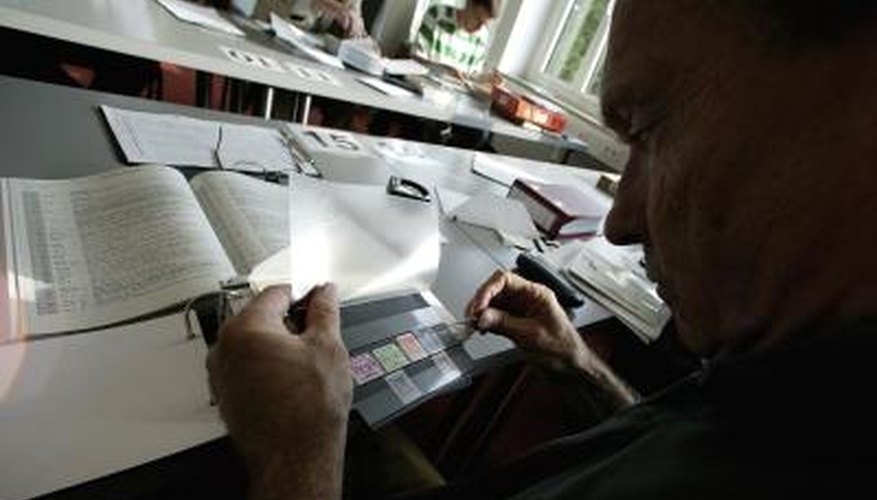 A collector examines stamps A collector examines stamps