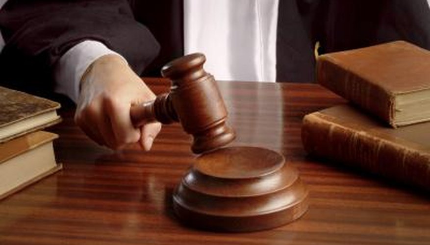Judge hitting gavel Judge hitting gavel