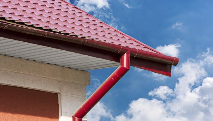 Downspout attached to the gutter of a house. Downspout attached to the gutter of a house.