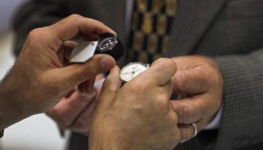 A watch being examined by professional A watch being examined by professional