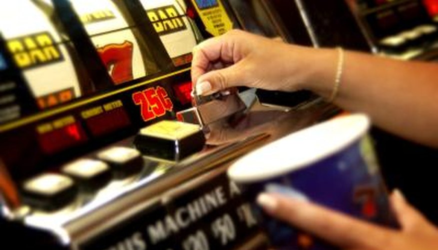 Hands playing slot machine Hands playing slot machine