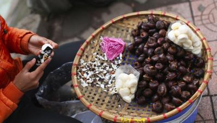 Water chestnuts being peeled Water chestnuts being peeled