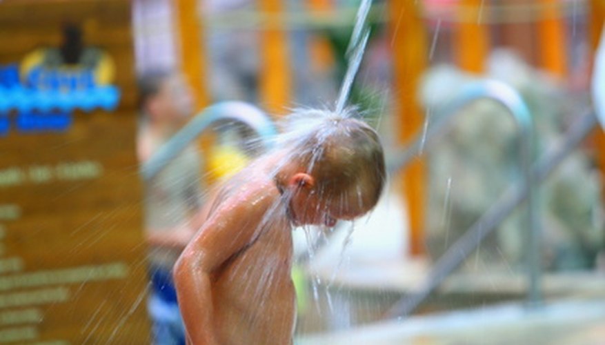 Child shown at the East Lansing Aquatic Center enjoying water activities. Child shown at the East Lansing Aquatic Center enjoying water activities.